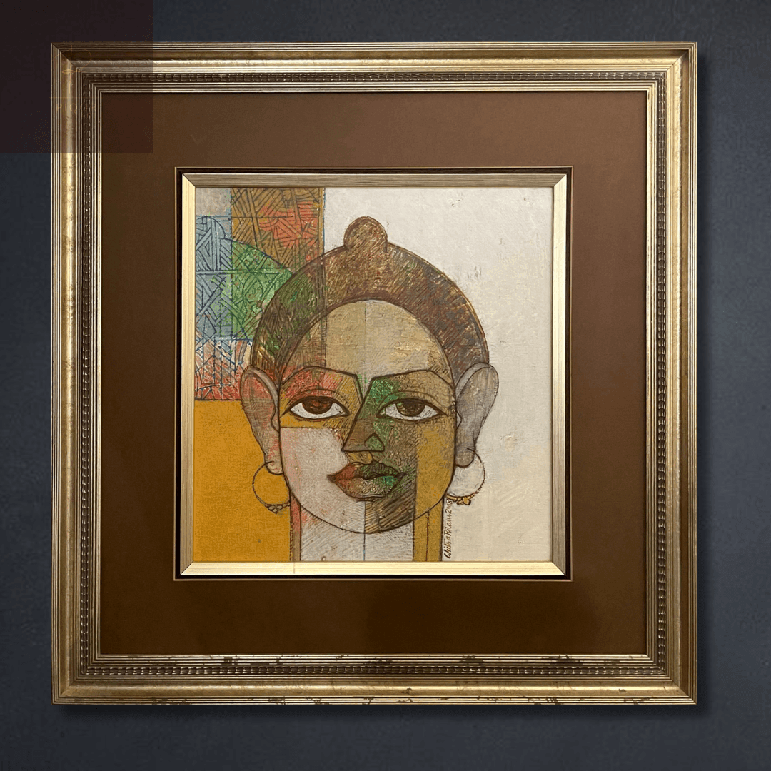 Framed artwork featuring a geometric portrait with vibrant colors and abstract patterns.